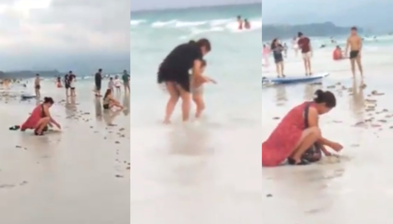Gruaja filmohet duke groposur pelenën e pisët në rërë, autoritetet mbyllin plazhin