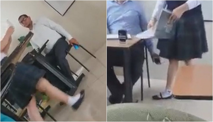 Ajo i afrohet tek tavolina, profesori kapet ‘mat’ duke fotografuar mes këmbëve nxënësen e tij