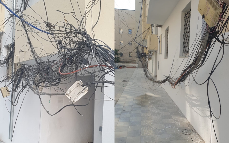 Ca të varura si rrjet merimange, ca në tokë! Kabllot e OSHEE dhe internetit rrezikojnë banorët e rrugës “Luigj Gurakuqi”