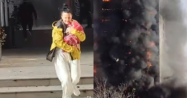 Pamje apokaliptike  Nëna me foshnjën në krahë nxiton të largohet nga ferri i flakëve